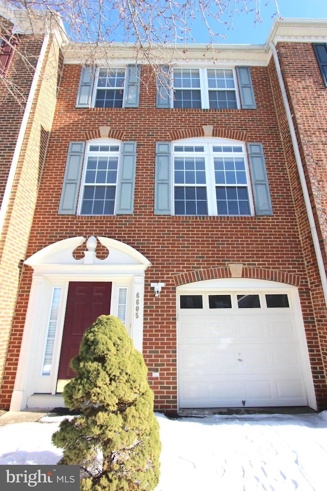 multi unit property featuring a garage