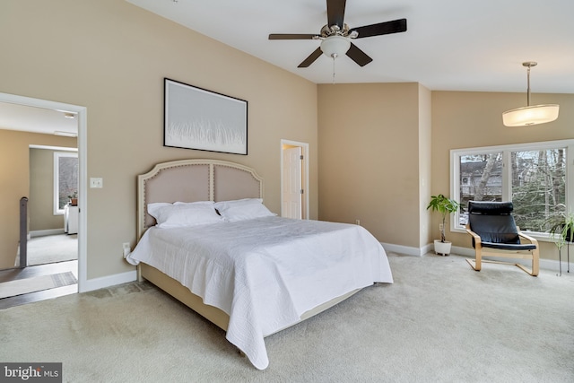 bedroom featuring vaulted ceiling, ceiling fan, and carpet