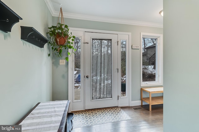 doorway to outside with crown molding and light hardwood / wood-style flooring