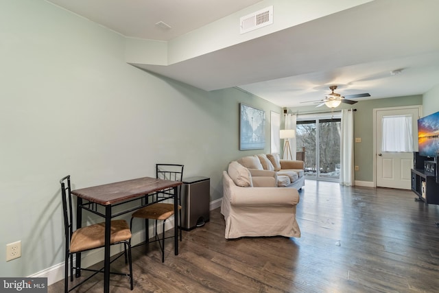 interior space with dark wood-type flooring and ceiling fan