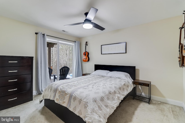 carpeted bedroom with access to exterior and ceiling fan