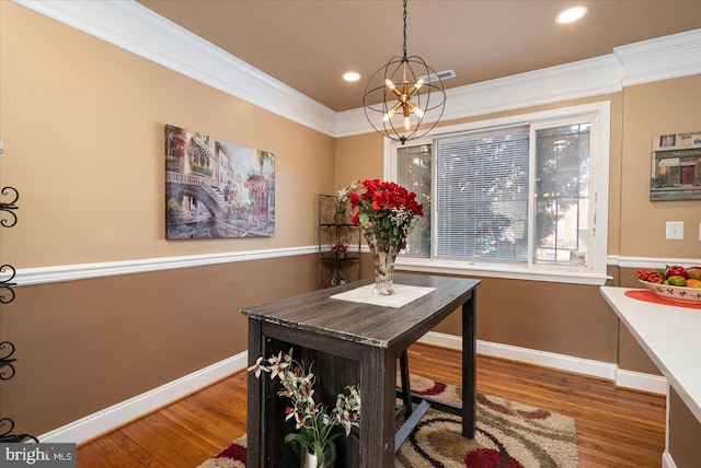 office featuring ornamental molding, dark wood-type flooring, and a notable chandelier