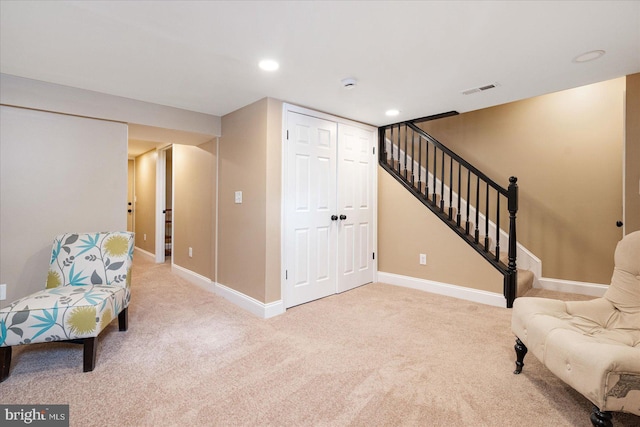 sitting room with carpet floors