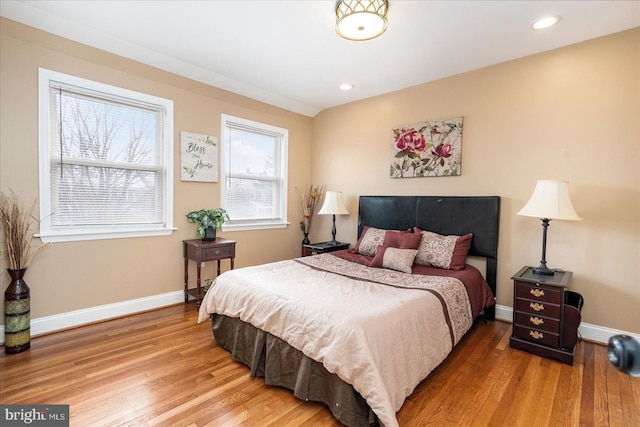 bedroom with hardwood / wood-style floors