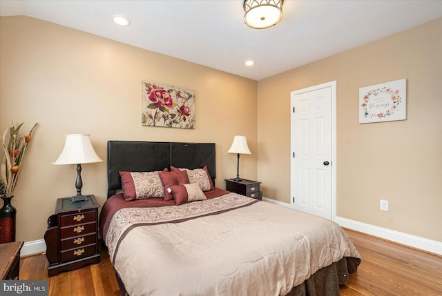 bedroom with hardwood / wood-style floors