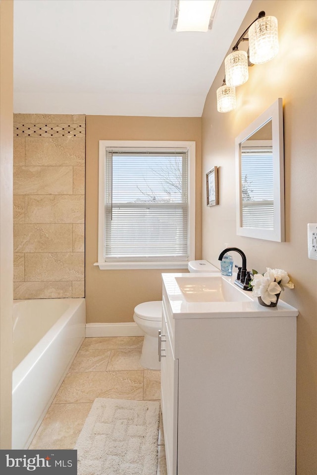 bathroom featuring tile patterned floors, vanity, and toilet