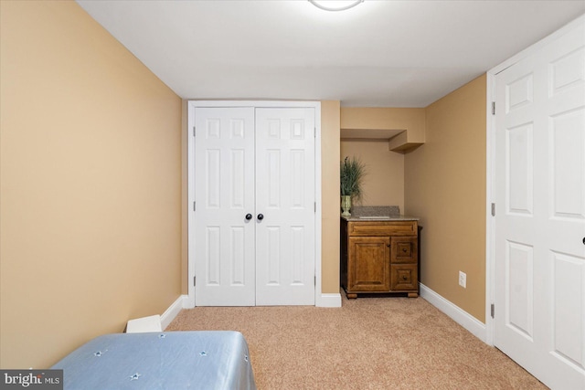 carpeted bedroom with a closet