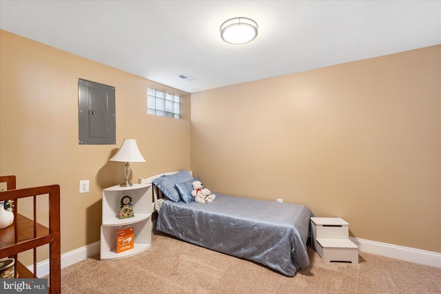 bedroom with carpet floors and electric panel