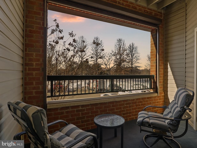 view of balcony at dusk