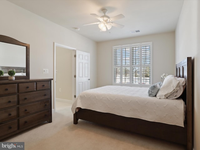 bedroom featuring light carpet and ceiling fan