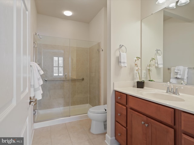 bathroom featuring an enclosed shower, vanity, tile patterned flooring, and toilet