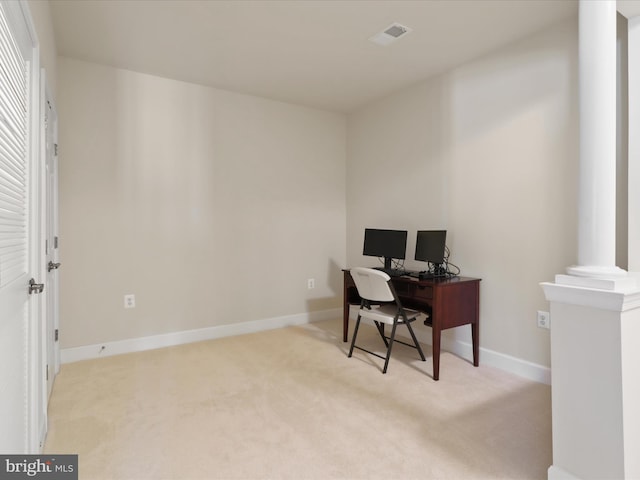 office space with light colored carpet