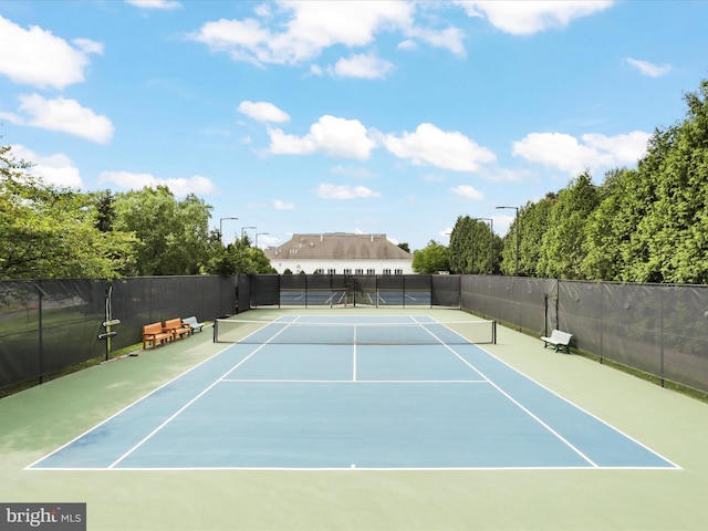 view of sport court featuring basketball hoop