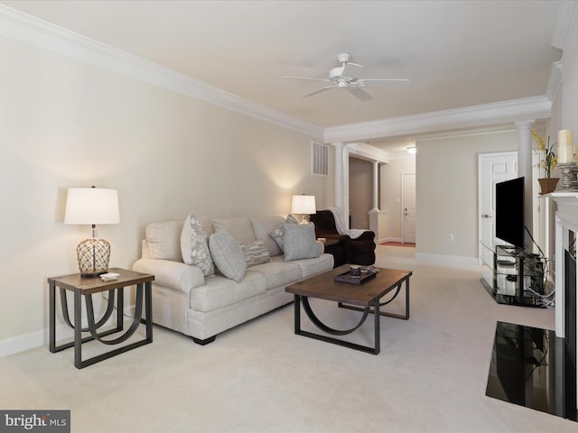 carpeted living room with ceiling fan, ornamental molding, and a fireplace