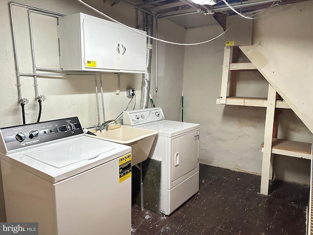 laundry area with washer and dryer and sink