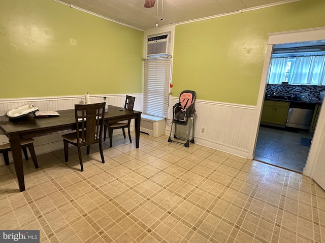 dining area with ceiling fan, ornamental molding, and a wall unit AC