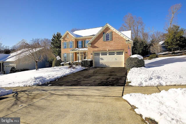 front of property with a garage