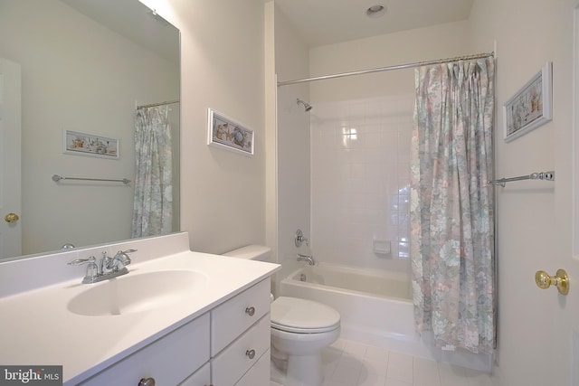 full bathroom featuring vanity, tile patterned flooring, toilet, and shower / bath combo with shower curtain