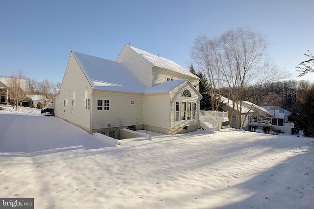 view of snow covered house