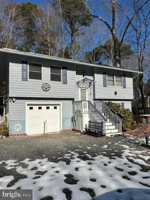 split foyer home featuring a garage