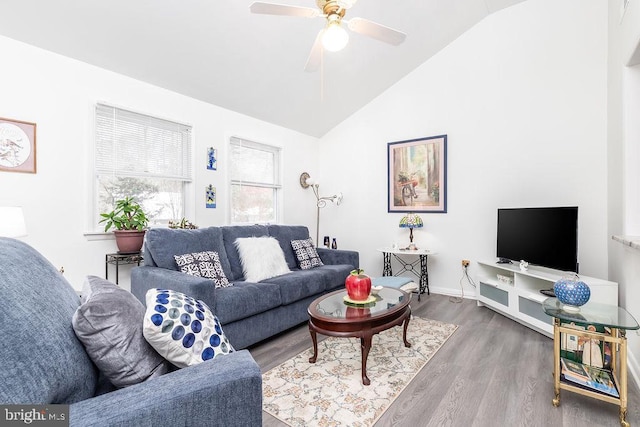 living room featuring lofted ceiling, wood-type flooring, and ceiling fan