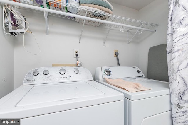 clothes washing area with independent washer and dryer