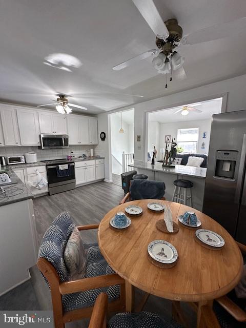 dining room featuring dark hardwood / wood-style flooring