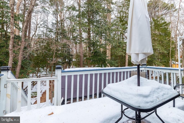 view of snow covered deck