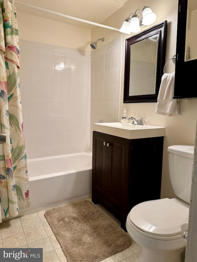 full bathroom with vanity, tile patterned floors, toilet, and shower / bath combo