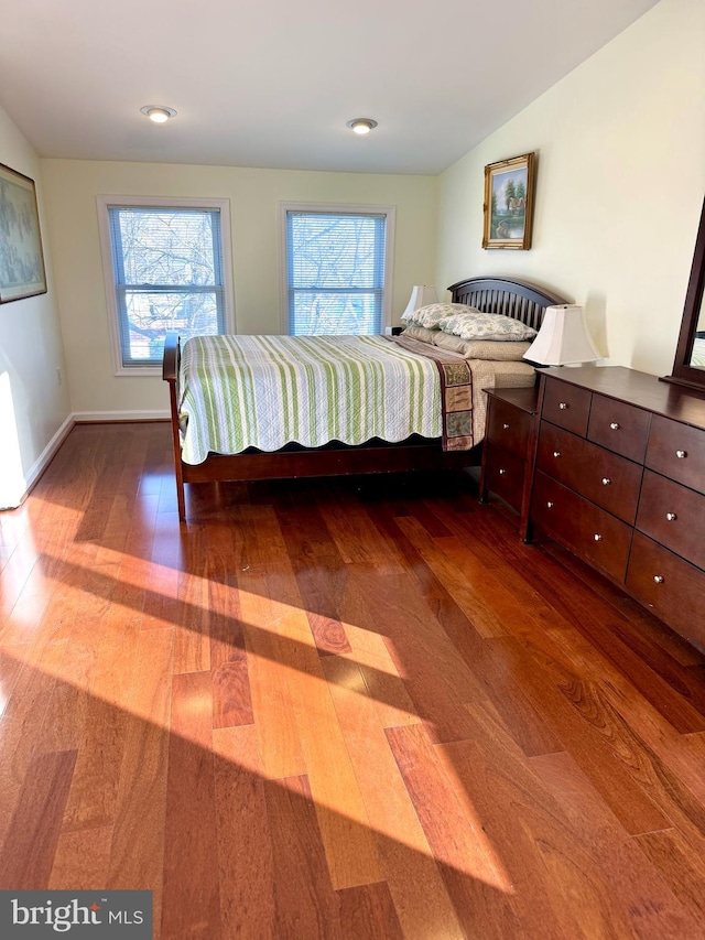 bedroom featuring lofted ceiling and wood-type flooring