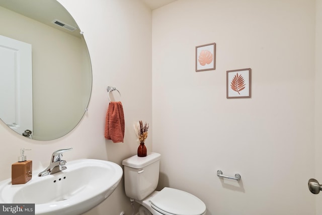 bathroom with toilet and sink