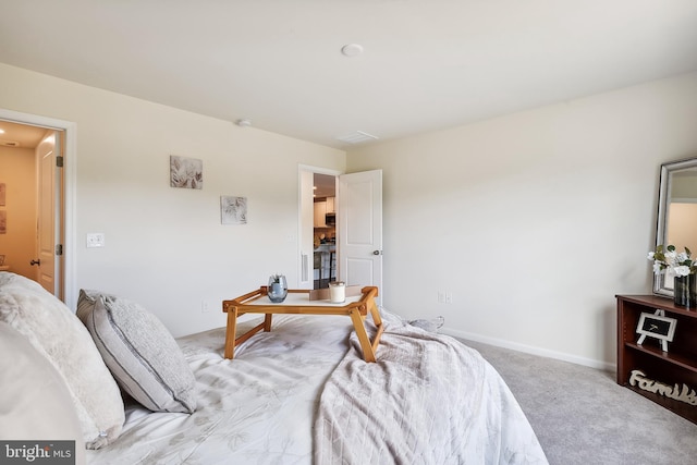 bedroom with light carpet