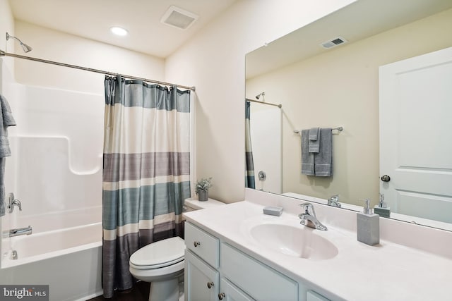 full bathroom with toilet, vanity, and shower / bath combo