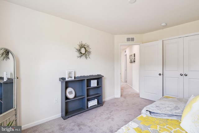 carpeted bedroom with a closet