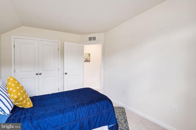 carpeted bedroom featuring a closet