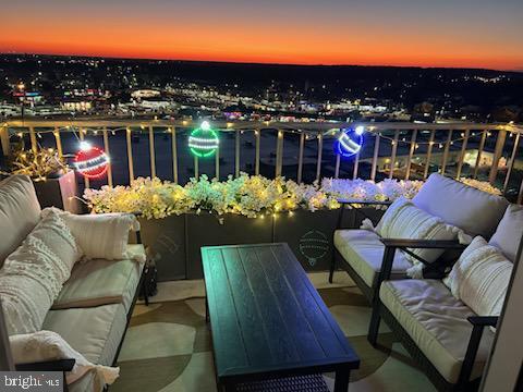 balcony at dusk with outdoor lounge area