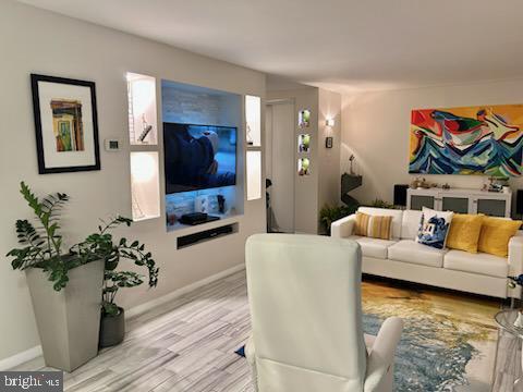 living room with light hardwood / wood-style flooring