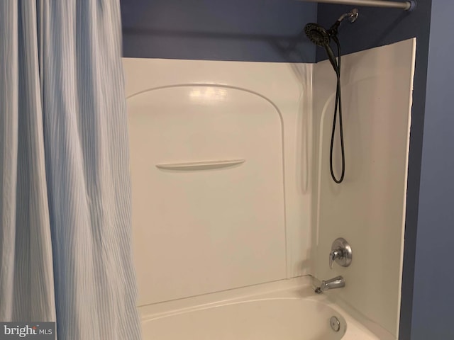 bathroom featuring shower / tub combo with curtain