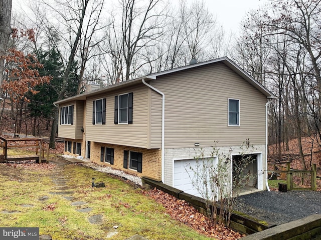 view of side of property with a garage