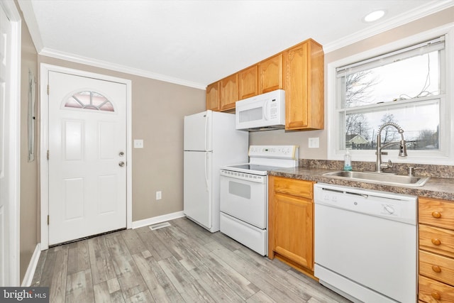 kitchen featuring crown molding, sink, white appliances, and light hardwood / wood-style flooring