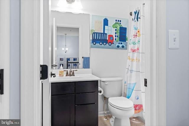 bathroom featuring toilet and vanity