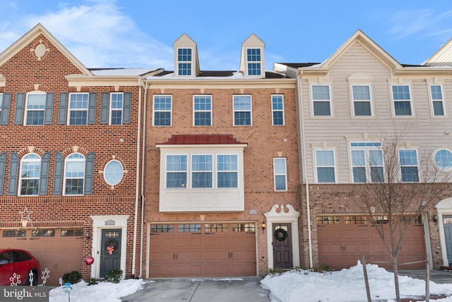 townhome / multi-family property featuring a garage