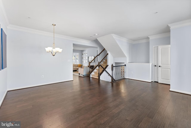 unfurnished living room featuring an inviting chandelier, ornamental molding, and dark hardwood / wood-style floors