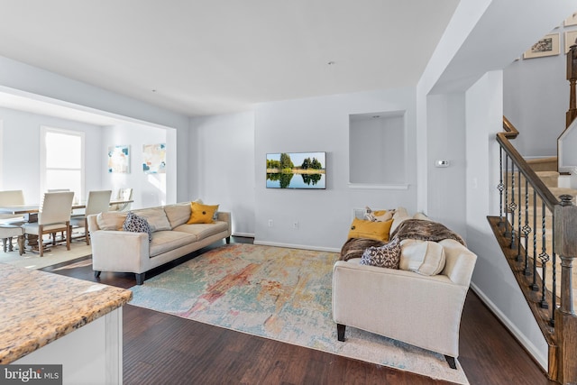 living room featuring dark hardwood / wood-style flooring