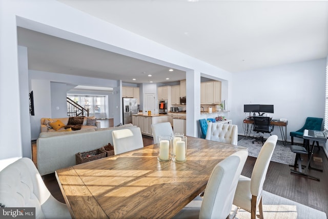 dining space with light hardwood / wood-style flooring