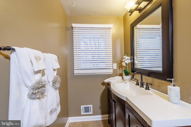 bathroom with vanity and tile patterned floors