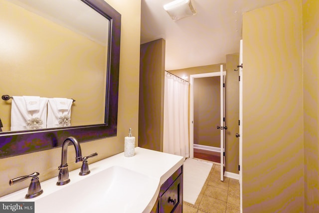 bathroom with tile patterned floors and vanity