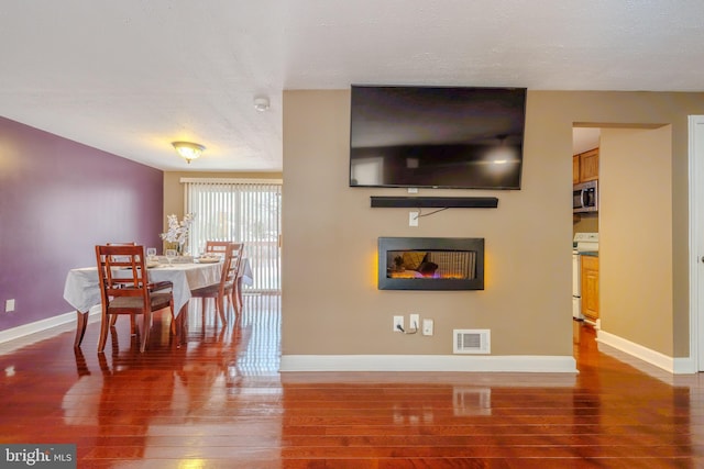 living room featuring dark hardwood / wood-style floors