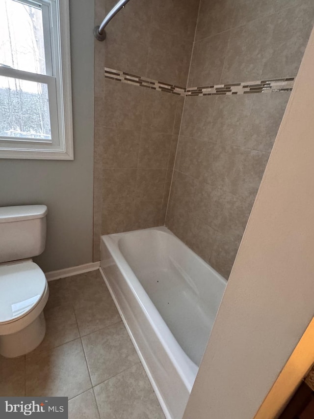 bathroom featuring tile patterned flooring and toilet