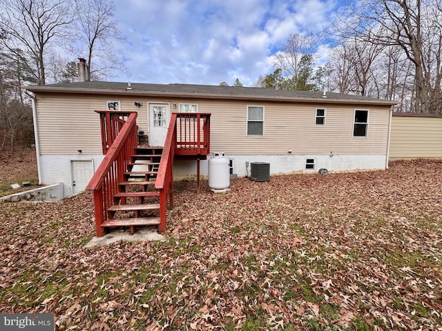 back of property with cooling unit and a deck